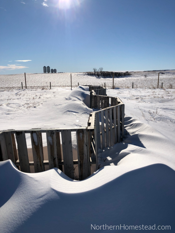 Snow cover with a pallet fence